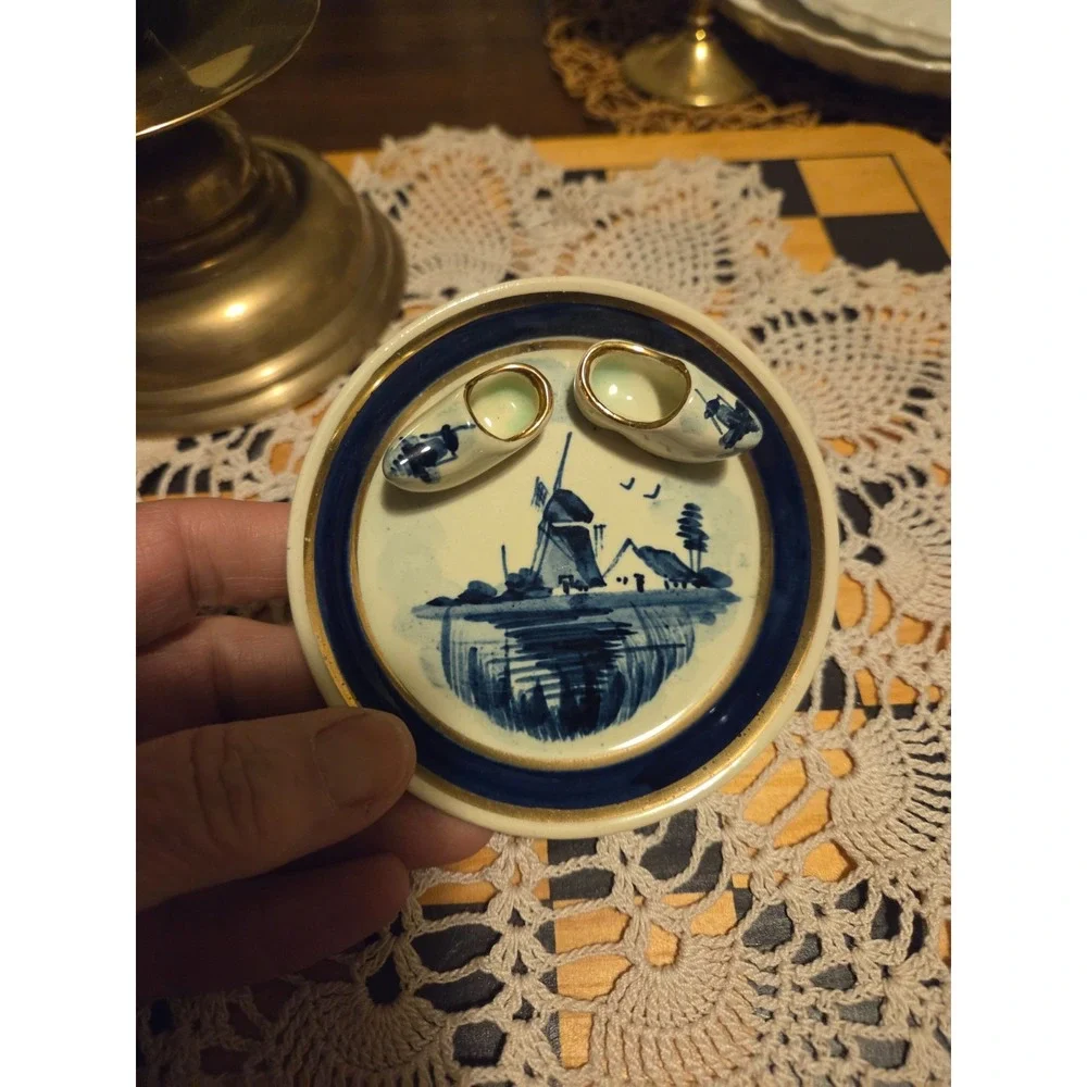 delft blue hand painted holland plate With Little Shoes Attached.